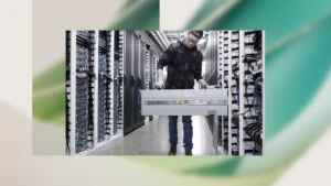 A decorative image of a person working in a datacenter over an abstract background.