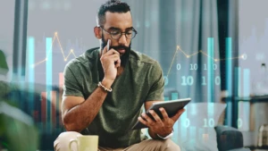 man looking at his tablet