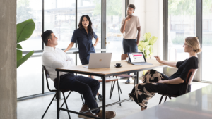 Image of a team of four firstline workers collaborating around a table.