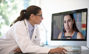 A doctor using Microsoft Teams to have a virtual appointment with a patient.