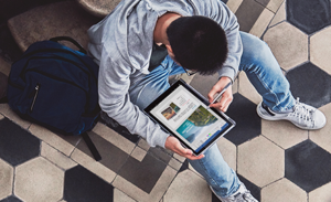 Image of a student working on a tablet in the Greater China Region.