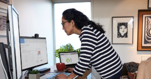 A woman working at her desk.