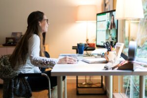 Woman using Skype for work meeting.