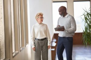 Employees talking in a hallway.