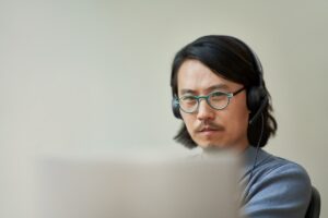 Security practitioner working from home and collaborating in remote call.