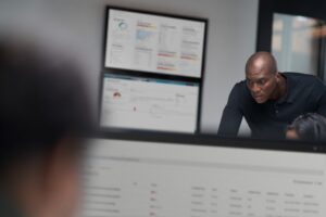 Chief information security officer collaborating in a security operations center.