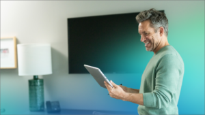 A man holding a tablet.