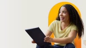 a woman sitting in front of a laptop