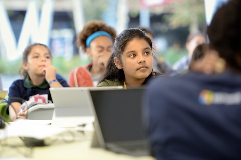 Group of middle school students in classroom setting.