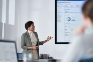 Chief information security officer presents to the board of executives on security topics in a conference room setting.