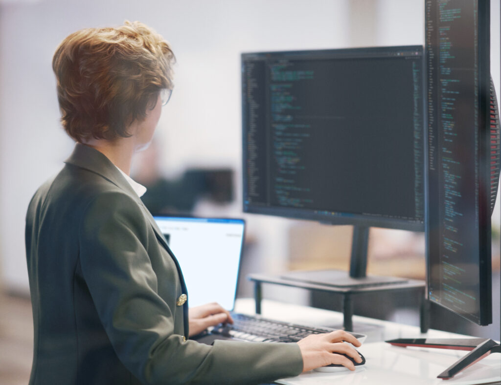 a person standing in front of a computer