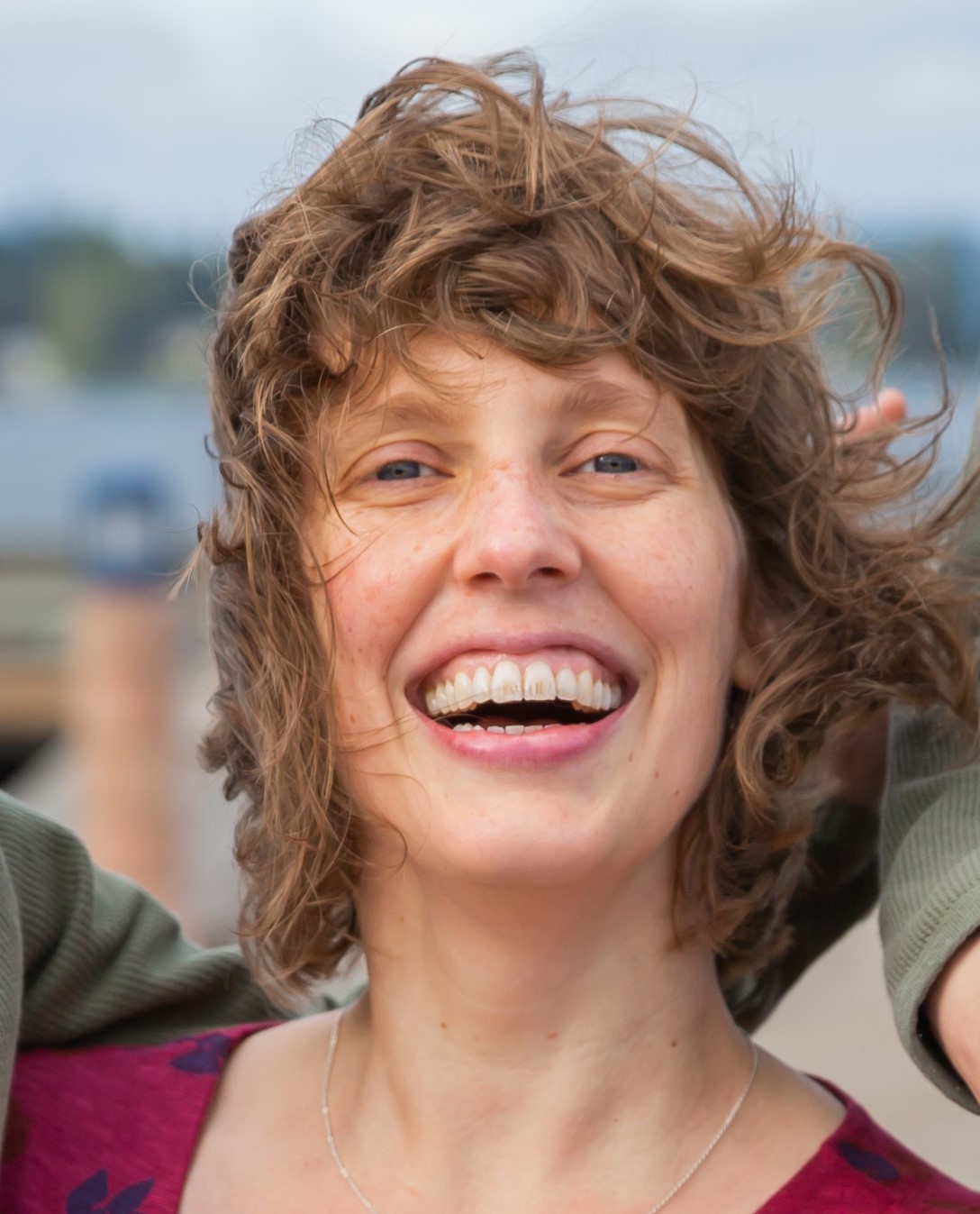 A close up of the author, Kate Smith, smiling at the camera.