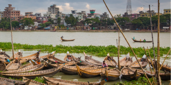 A bunch of passenger boats in the Buriganga River near Dhaka, Bangladesh