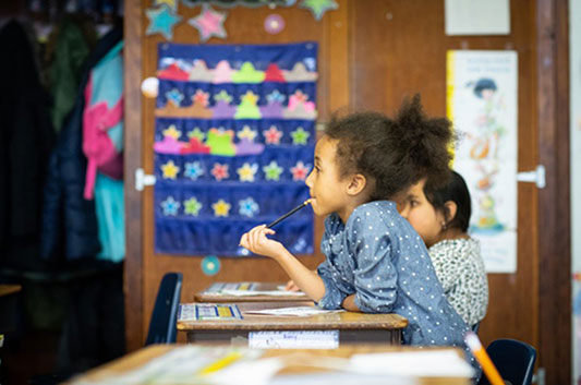 photo: Children Sitting by the Desk