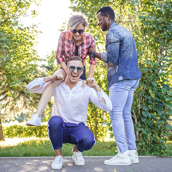 A group of people standing in a park.