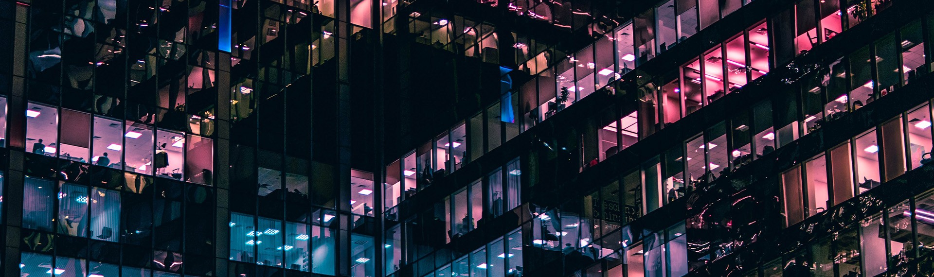 A building is lit up at night.