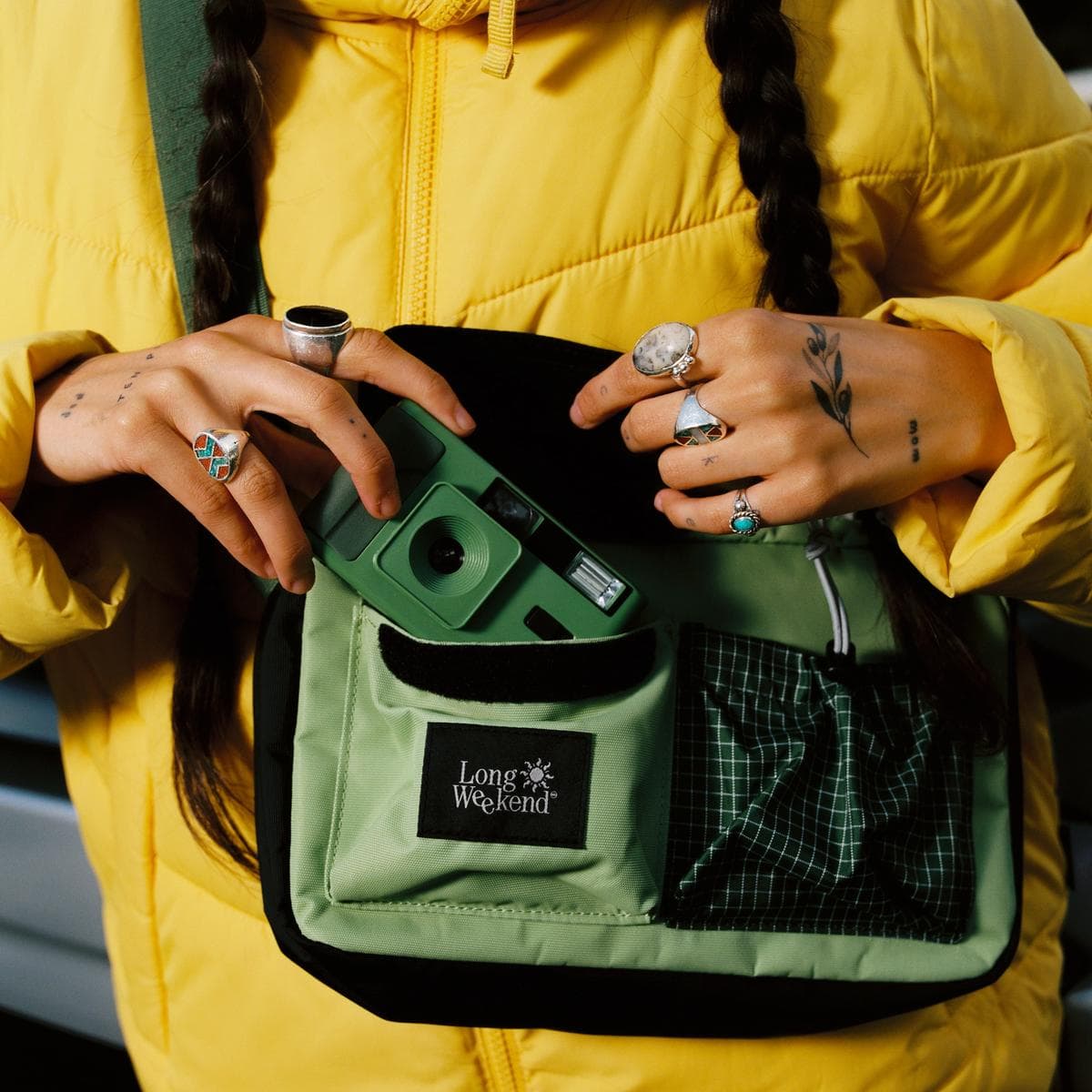 The Long Weekend Moss shoulder bag over a yellow jacket in California, shot by Willem.