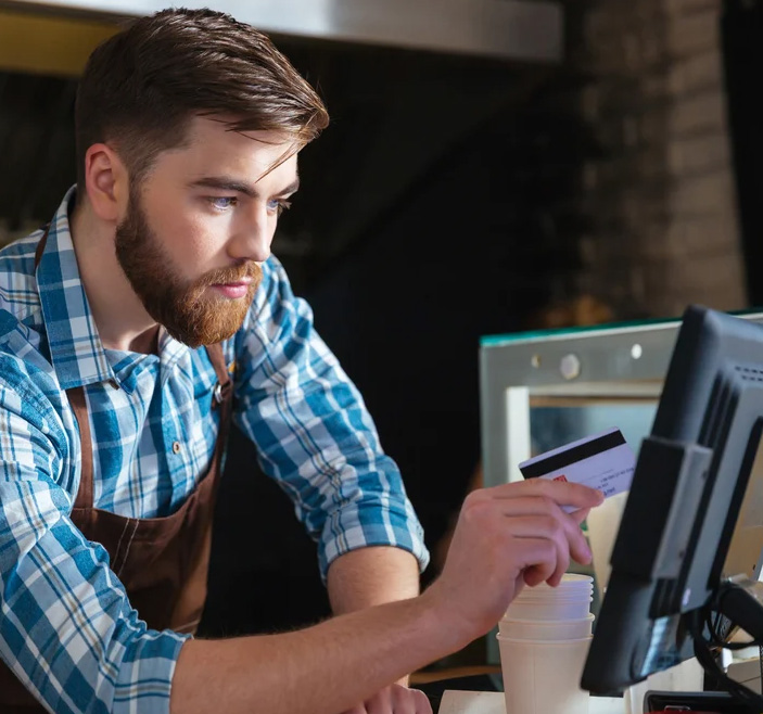 Man working in a coffee shop. 