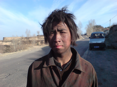 coal covered man in Linfen China