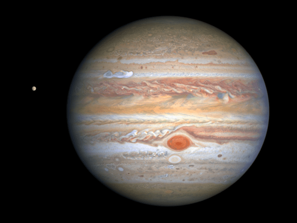 This latest image of Jupiter, taken by NASA’s Hubble Space Telescope on Aug. 25, 2020, was captured when the planet was 406 million miles from Earth. A unique and exciting detail of Hubble’s snapshot appears at mid-northern latitudes as a bright, white, stretched-out storm traveling around the planet at 350 mph. Hubble shows that the Great Red Spot, rolling counterclockwise in the planet’s southern hemisphere, is plowing into the clouds ahead of it, forming a cascade of white and beige ribbons. Jupiter’s icy moon Europa, thought to hold potential ingredients for life, is visible to the left of the gas giant.