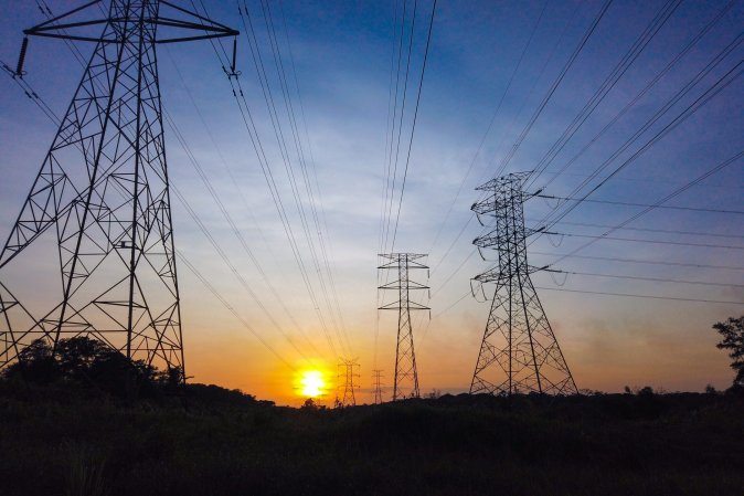 Power lines against sunset.