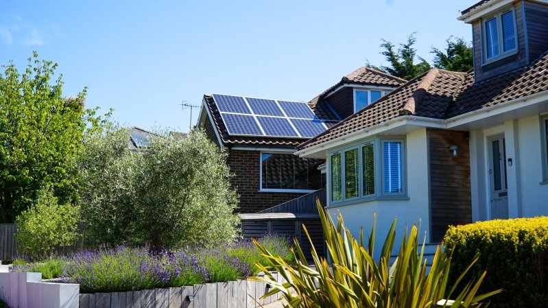 House with solar panels on roof.