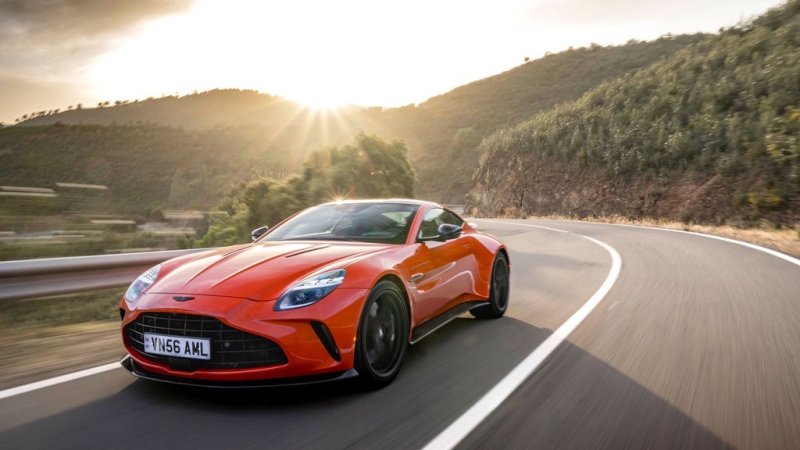 orange sports car on a road