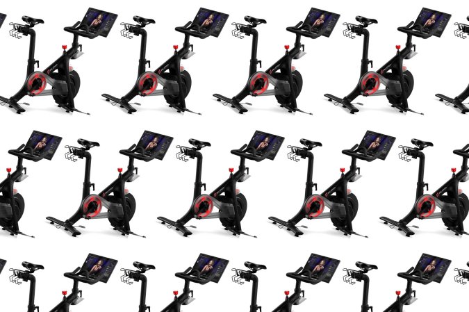 Peloton bikes in a pattern on a plain background.