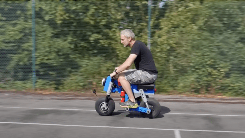 Man riding on 3D printed Lego minibike