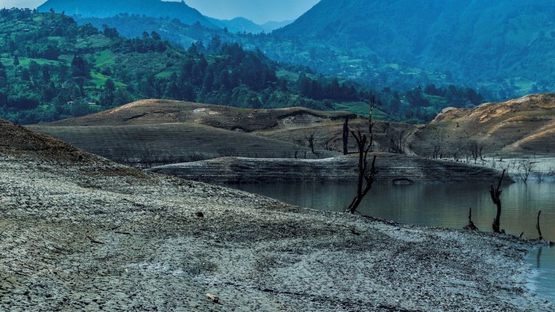 a reservoir in colombia with very low water levels due to drought