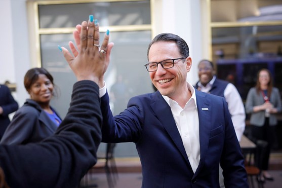 Governor Josh Shapiro high-fiving people