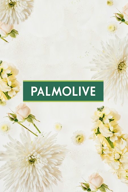 Palmolive-Logo auf hellem Hintergrund und Blumen.