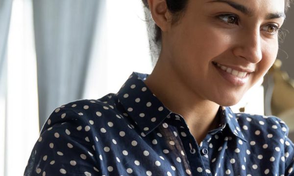 Positive female in an office reviewing data