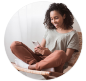 Woman sitting on chair and looking at phone