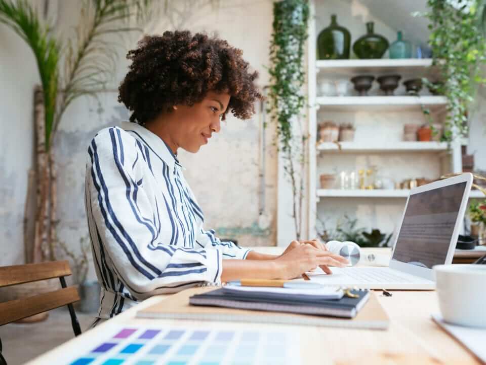 Product Managment Trends Woman Sitting at Desk