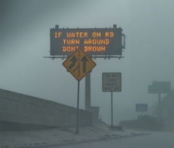 lighted highway sign recommends evacuation for hurricane