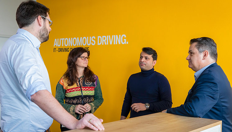 BMW team meeting with yellow wall