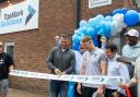 Thriving business expands to town and Warrington Wolves stars were there to celebrate