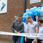 Thriving business expands to town and Warrington Wolves stars were there to celebrate