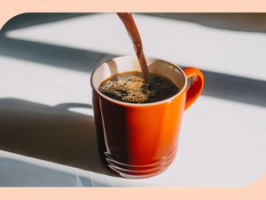 Coffee being poured into a coffee mug