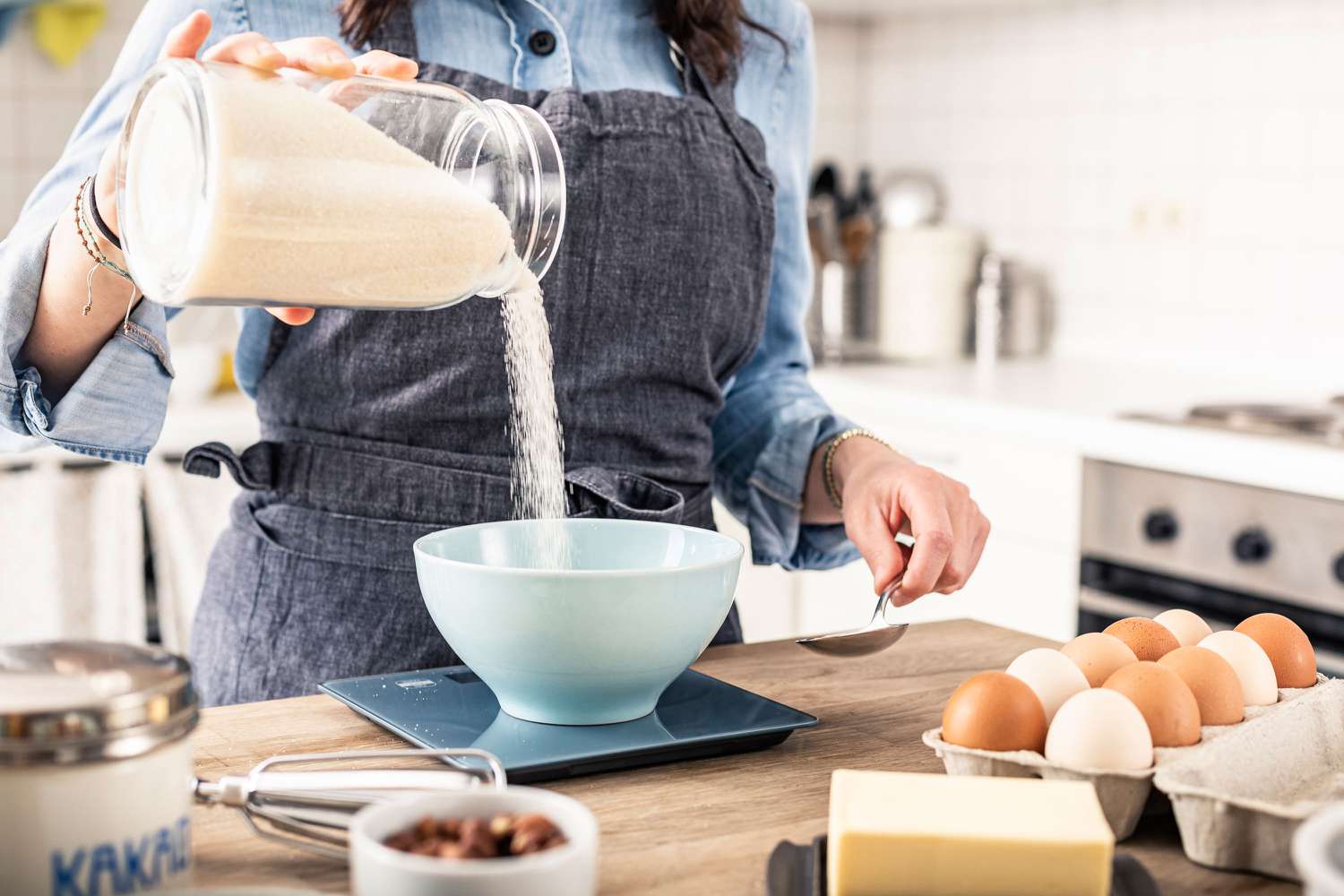 Measuring sugar on a digital kitchen scale