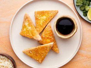 Deep-fried tofu with soy sauce on a plate 