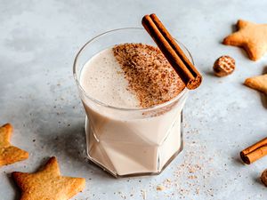 Coquito Puerto Rican no-egg eggnog garnished with a cinnamon stick