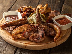 barbecue meats on a serving board