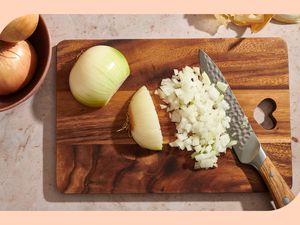 Photo of an onion being diced on a cutting board