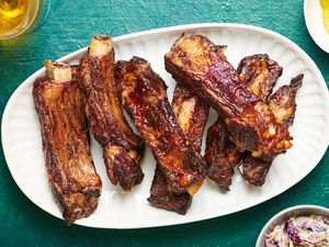 Tender Slow-Grilled Beef Ribs on a white platter 