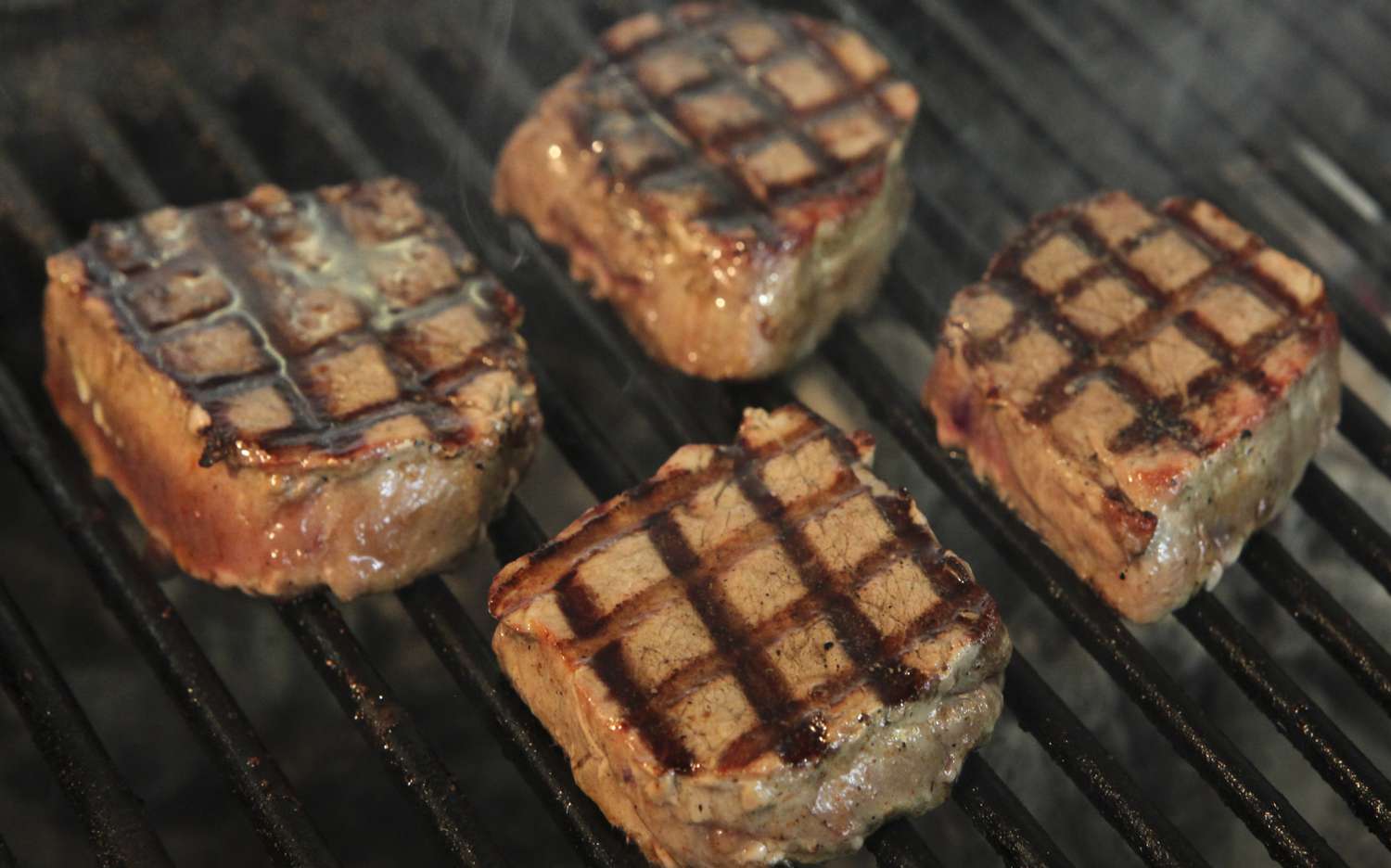 Beef steak grilled on a charcoal barbecue