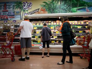 people shopping in Trader Joe's