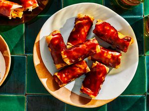 Filipino fried banana rolls on a plate