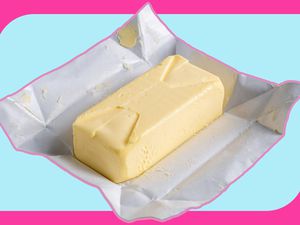 A stick of butter with the wrapper open